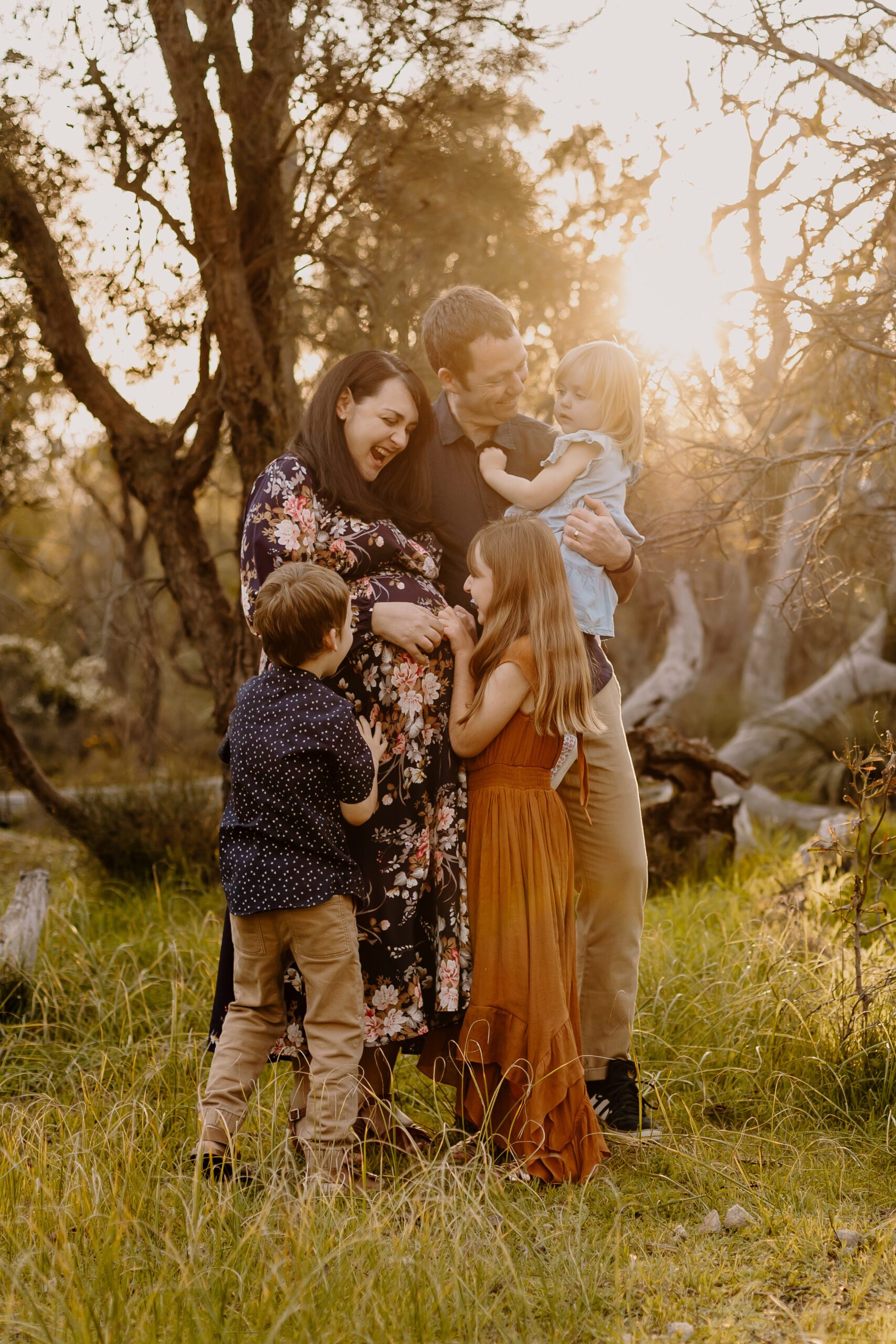 family hugging at golden hour in perth western australia